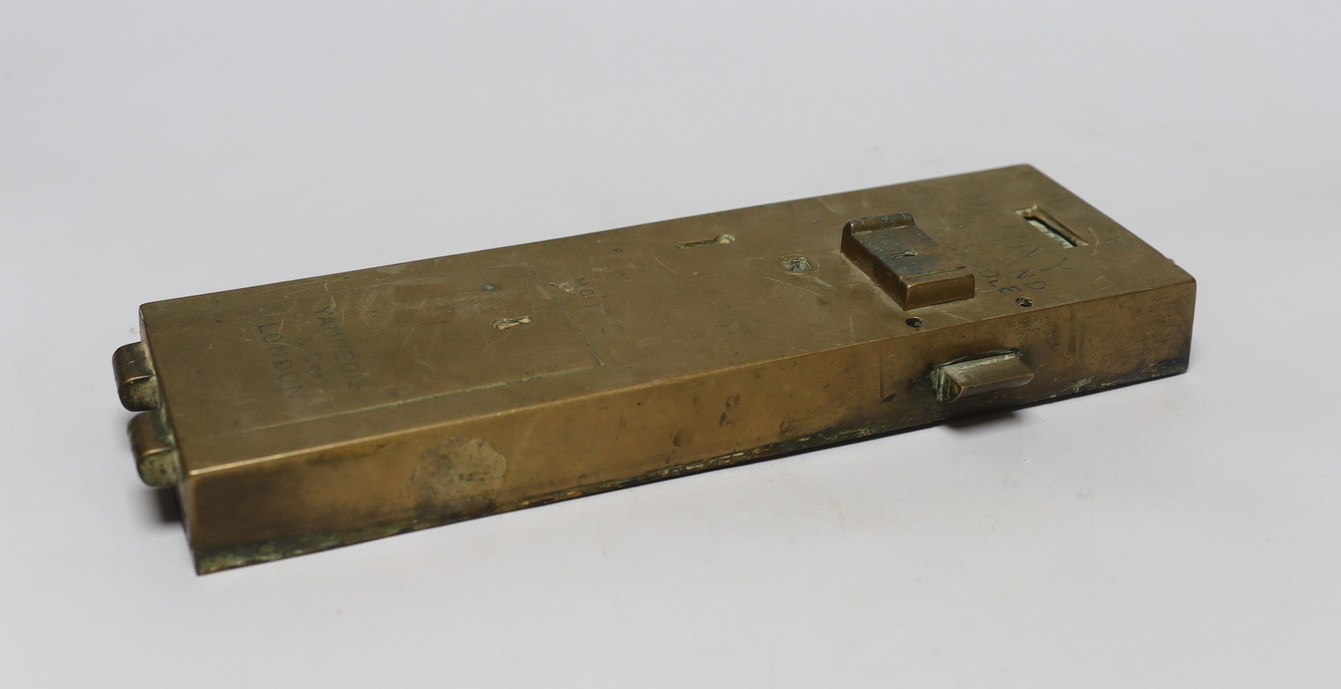 A Yannedis & Co brass lavatory coin-in-slot lock